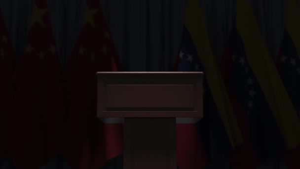 Many flags of Venezuela and China behind speaker tribune, 3D animation — Stock Video