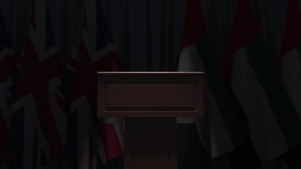 Flags of the UAE and the United Kingdom at international meeting, 3D animation — Stock Video