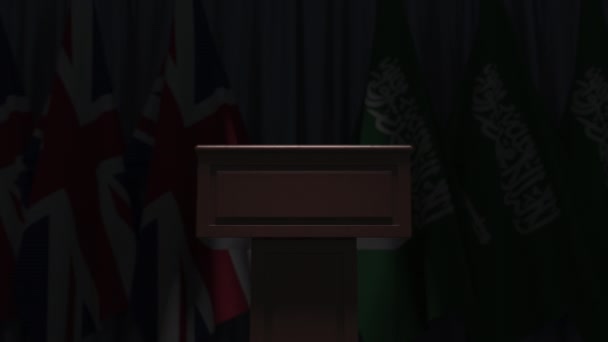 Flags of Saudi arabia and the United Kingdom at international meeting, 3D animation — ストック動画