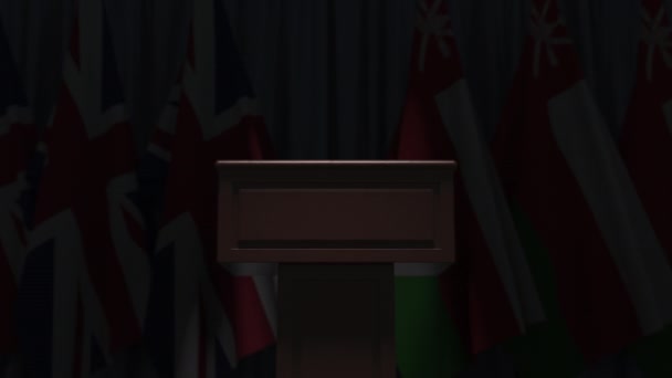 Vlaggen van Oman en het Verenigd Koninkrijk op internationale bijeenkomst, 3D-animatie — Stockvideo