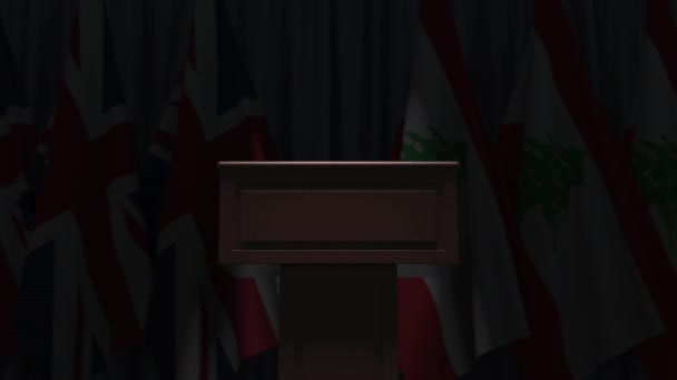 Many flags of Lebanon and the United Kingdom behind speaker tribune, 3D animation — Stock Video