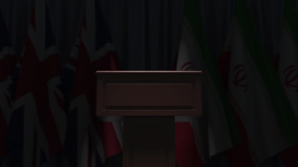 Many flags of Iran and the United Kingdom behind speaker tribune, 3D animation — Stock Video