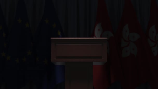 Row of flags of Hong kong and the European Union EU and and speaker tribune, conceptual 3D animation — Stock Video