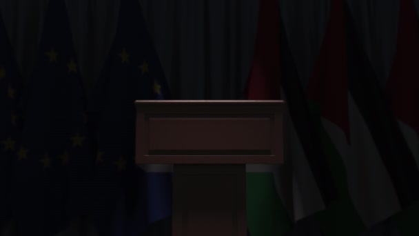 Veel vlaggen van Jordanië en de Eu achter spreker tribune, 3D-animatie — Stockvideo