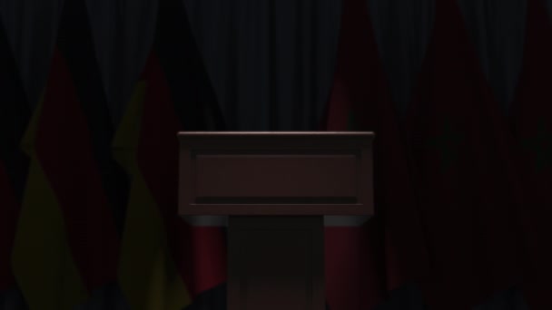 许多摩洛哥和德国国旗在音箱后面，3D动画 — 图库视频影像