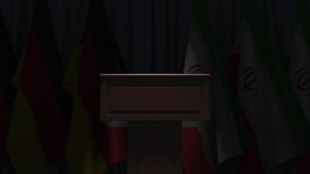 Many flags of Iran and Germany behind speaker tribune, 3D animation — Stock Video