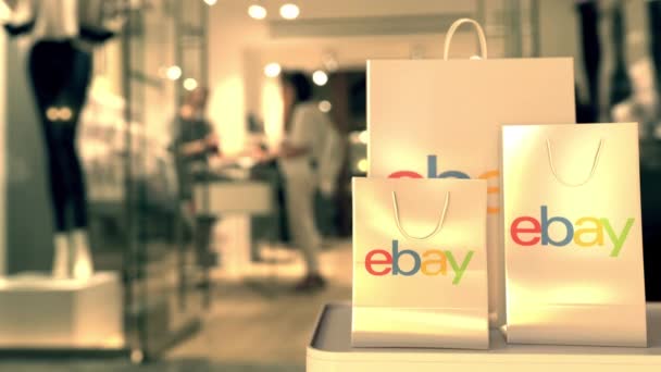Bolsas de compras con logotipo de eBay. Editorial online shopping versus retail animación 3D relacionada — Vídeo de stock