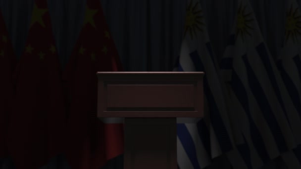 Flags of Uruguay and China and tribune, 3D animation — Stock Video