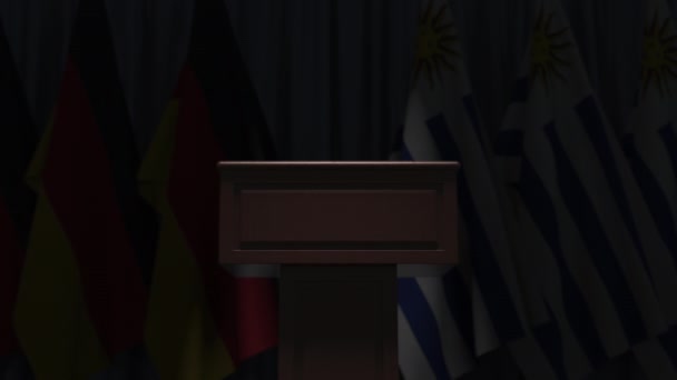 Banderas de Uruguay y Alemania y tribuna, animación 3D — Vídeos de Stock