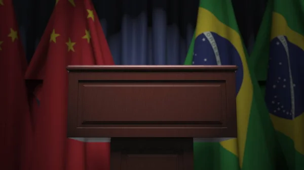 Vele vlaggen van Brazilië en China achter luidspreker tribune, 3d rendering — Stockfoto