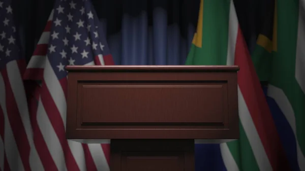 Reihe von Flaggen Südafrikas und der USA und Sprechertribüne, konzeptionelle 3D-Darstellung — Stockfoto