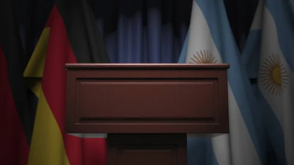 Fila de banderas de Argentina y Alemania y tribuna de oradores, representación conceptual 3D — Foto de Stock