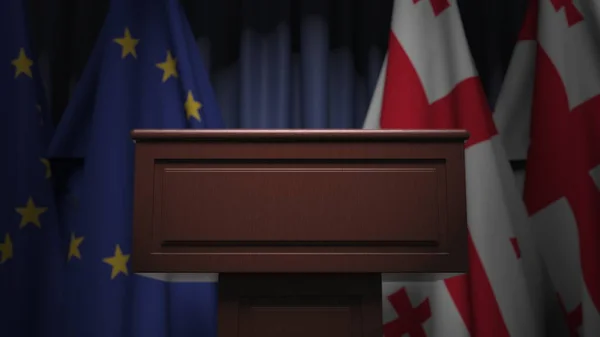 Fila de bandeiras de Geogia e da União Europeia UE e tribuno orador, renderização 3D conceitual — Fotografia de Stock