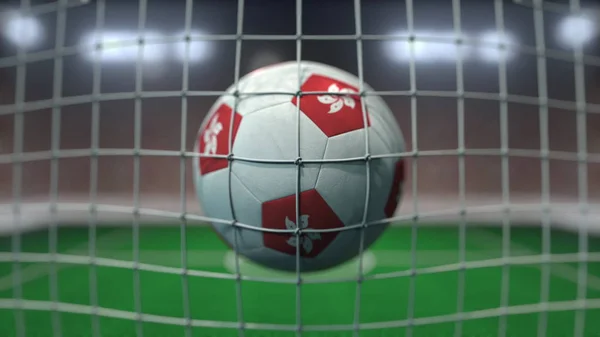 Football with flags of Hong Kong hits goal net. 3D rendering — Stock Photo, Image