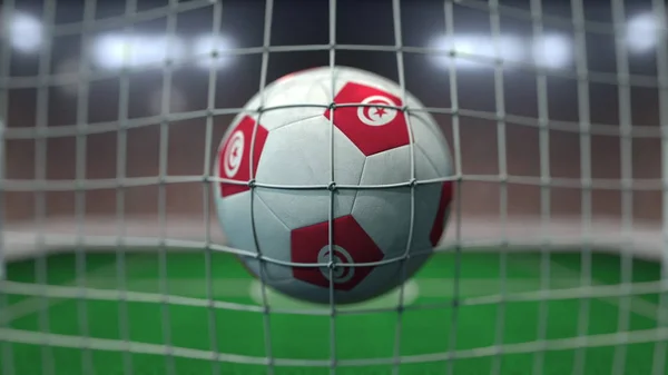 Football avec des drapeaux de la Tunisie au filet contre le stade flou. rendu 3D conceptuel — Photo