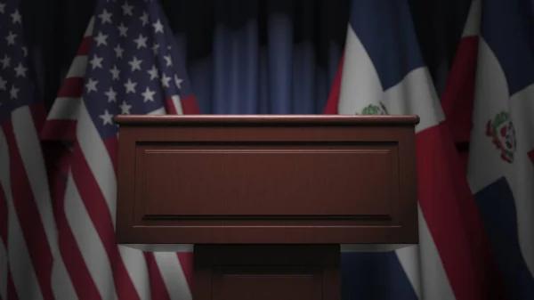 Vlaggen van de Dominicaanse Republiek en de Verenigde Staten op internationale vergadering, 3D-rendering — Stockfoto