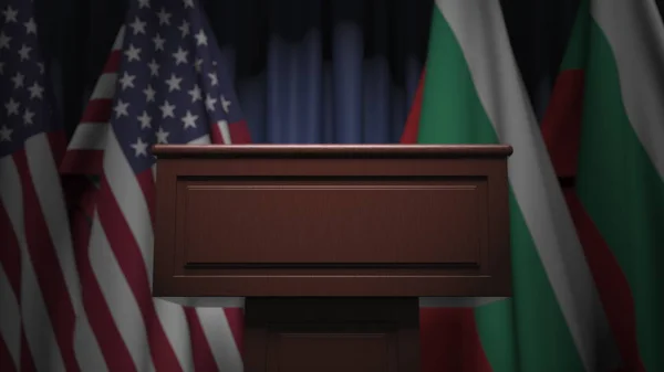 Many flags of Bulgaria and the USA behind speaker tribune, 3D rendering — Stock Photo, Image