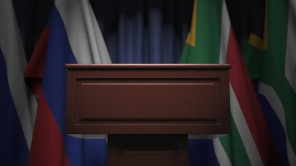 Dél-Afrika és Oroszország zászlajának sora és a szónoki tribunus, konceptuális 3D-s renderelés — Stock Fotó