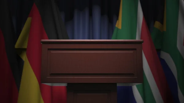 Σειρά σημαιών της Νότιας Αφρικής και της Γερμανίας και ομιλητής tribune, εννοιολογική 3d απόδοση — Φωτογραφία Αρχείου