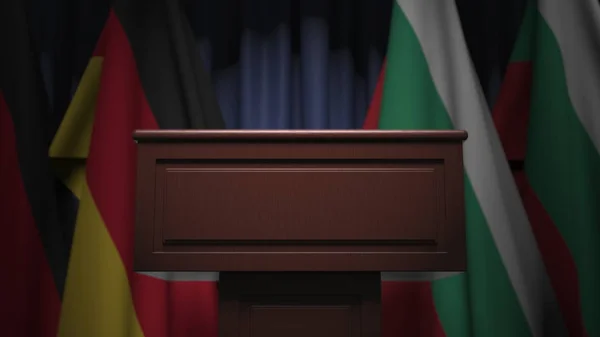 Rad av flaggor Bulgarien och Tyskland och högtalartribun, konceptuell 3d rendering — Stockfoto