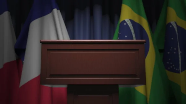 Muitas bandeiras do Brasil e da França atrás do tribuno de alto-falante, renderização 3D — Fotografia de Stock