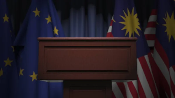 Прапори Малайзії та Європейського Союзу і трибуна, 3d рендеринг — стокове фото