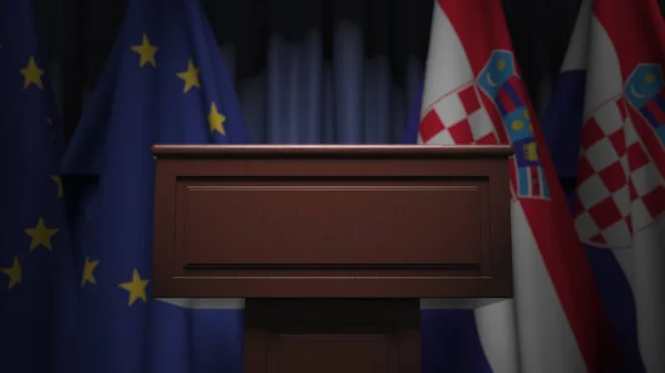 Rad av flaggor av Kroatien och Europeiska unionen Europa och talare tribun, konceptuell 3d rendering — Stockfoto
