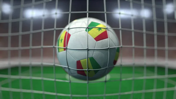 Football avec des drapeaux du Sénégal au filet contre le stade flou. rendu 3D conceptuel — Photo