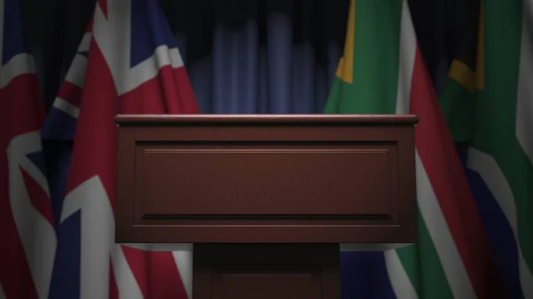 Σειρά σημαιών της Νότιας Αφρικής και του Ηνωμένου Βασιλείου και ομιλητής tribune, εννοιολογική 3d απόδοση — Φωτογραφία Αρχείου