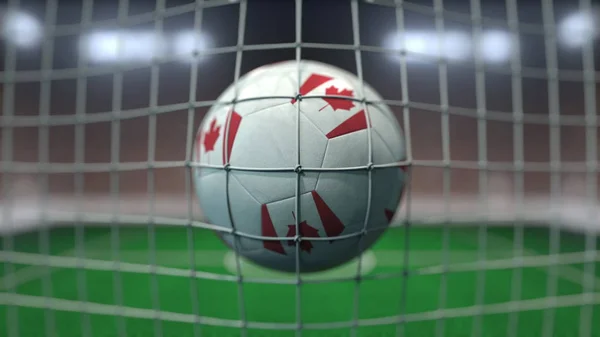 Le football avec les drapeaux du Canada frappe le filet de but. rendu 3D — Photo