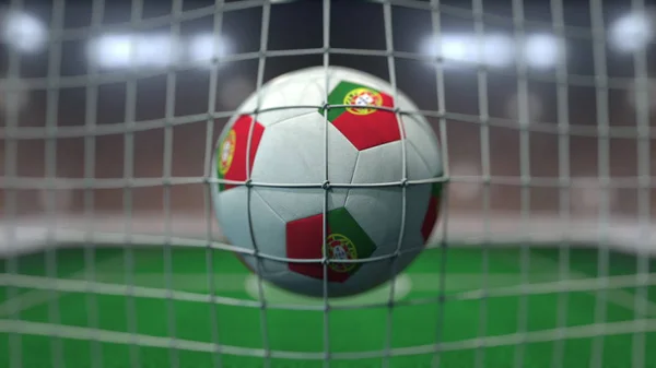 Футбол с флагами Португалии в сетке против размытого стадиона. 3D рендеринг — стоковое фото