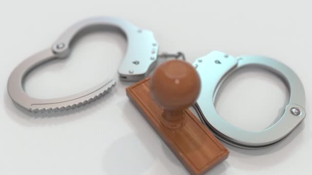 ANIMAL CRUELTY stamp and handcuffs. Crime and punishment related conceptual 3D animation — Stock Video