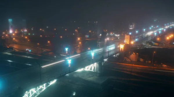 Aerial shot of an urban bridge traffic at rainy night. Warsaw, Poland — Stock Photo, Image