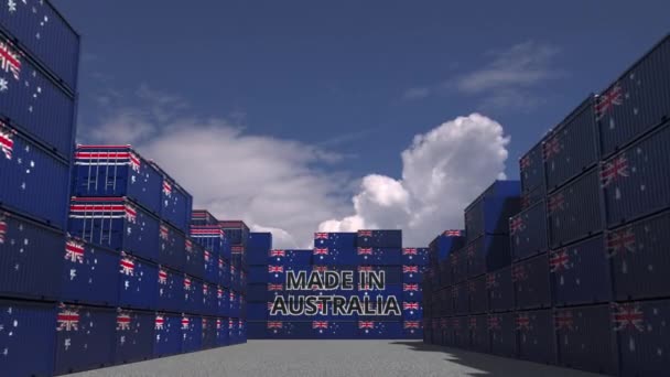 Many cargo containers with MADE IN AUSTRALIA text and national flags. Bahraini import or export related 3D animation — ストック動画