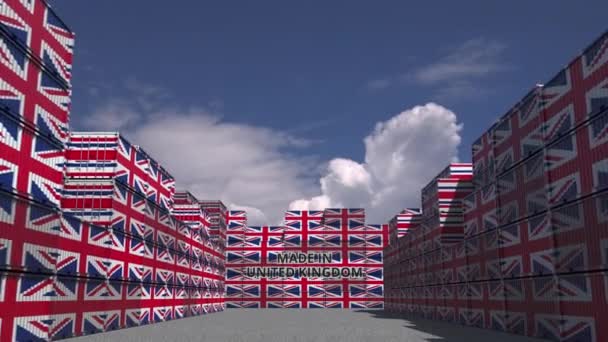 Many cargo containers with MADE IN UNITED KINGDOM text and national flags. British import or export related 3D animation — ストック動画