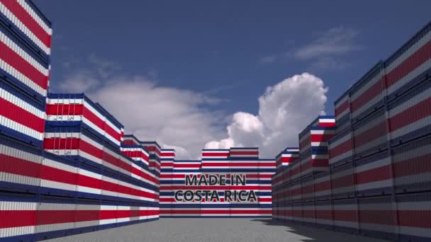 Many cargo containers with MADE IN COSTA RICA text and national flags. Import or export related 3D animation — ストック動画