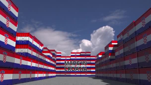 Many cargo containers with MADE IN CROATIA text and national flags. Croatian import or export related 3D animation — ストック動画