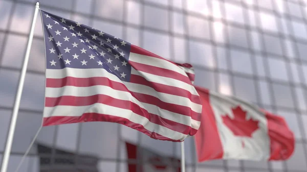 Ondeando banderas de los Estados Unidos y Canadá frente a una moderna fachada de rascacielos. Renderizado 3D — Foto de Stock