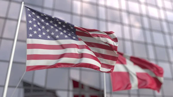 Waving flags of the USA and Denmark in front of a modern skyscraper facade. 3D rendering — Stock Photo, Image
