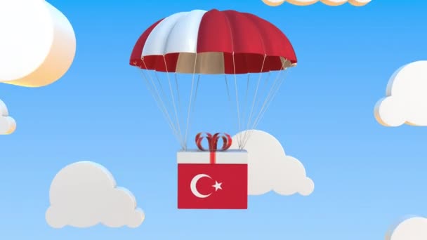 Carton avec drapeau de la Turquie tombe avec un parachute. Animation 3D conceptuelle bouclable — Video