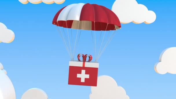 Carton avec drapeau de la Suisse tombe avec un parachute. Animation 3D conceptuelle bouclable — Video