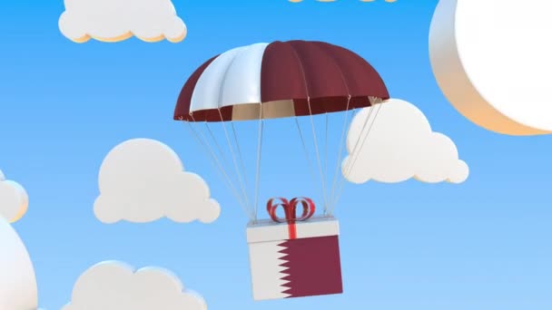 Doos met nationale vlag van Qatar valt met een parachute. Loopbare conceptuele 3D-animatie — Stockvideo