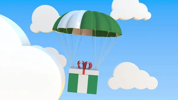 Box mit der Nationalflagge Nigerias fällt mit einem Fallschirm. 3D-Darstellung — Stockfoto