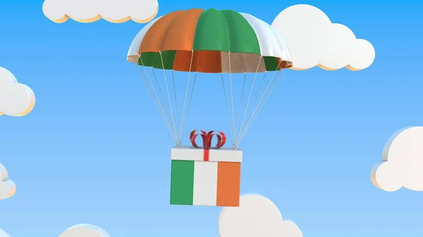 悬挂爱尔兰共和国国旗的纸板箱与降落伞一起坠落。 3d渲染 — 图库照片