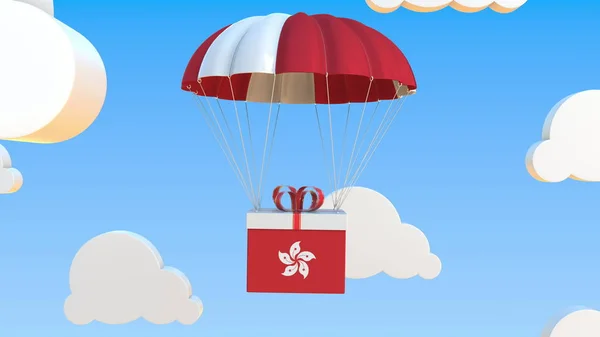 Box mit der Nationalflagge von Hongkong fällt mit einem Fallschirm. 3D-Darstellung — Stockfoto