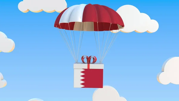 Коробка с национальным флагом Бахрейна падает с парашютом. 3D рендеринг — стоковое фото