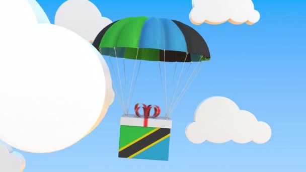 Cartón con bandera de Tanzania cae con un paracaídas. Animación 3D conceptual Loopable — Vídeos de Stock