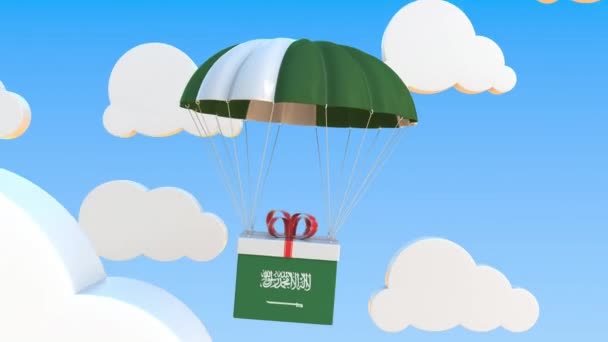 Caja con bandera nacional de Arabia Saudita cae con un paracaídas. Animación 3D conceptual Loopable — Vídeo de stock