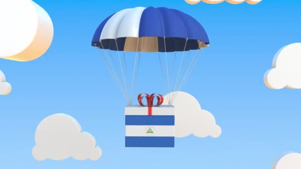 Scatola con bandiera nazionale del Nicaragua cade con un paracadute. Animazione 3D concettuale Loopable — Video Stock