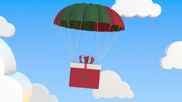 Carton avec drapeau du Maroc tombe avec un parachute. Animation 3D conceptuelle bouclable — Video